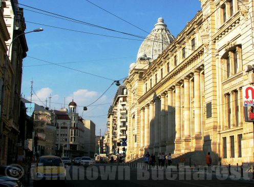 The beginning of the Calea Victoriei (the southern section) with the former Postal Palace on the right, enlightened by the sunset