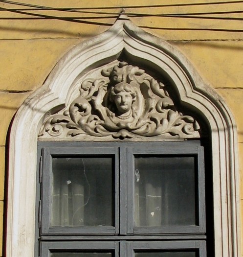 Window with stucco female head, Bucharest