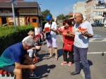 Enjoying fresh watermelon at farmers market in Brasov, Transylvania, Aug&nbsp;2018